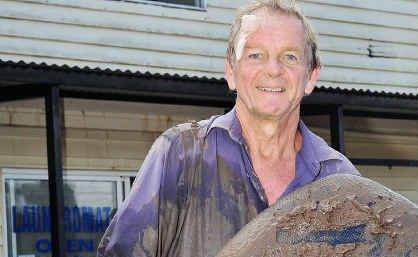 Alan Grimsley remains positive despite his office being ruined in the floods. Alan Grimsley remains positive despite his office being ruined in the floods.